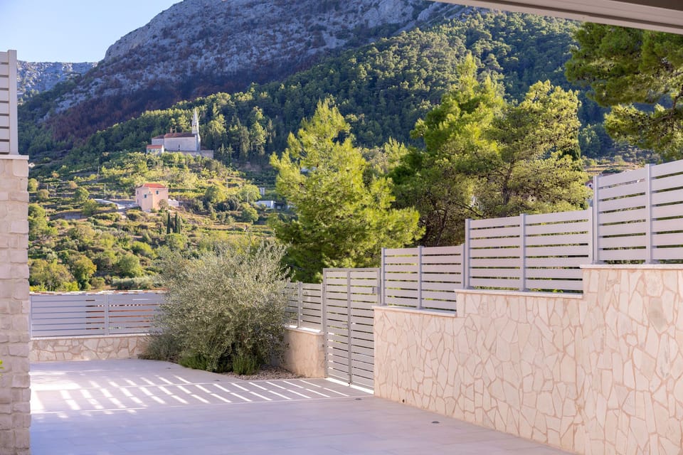 Villa Belpur | View from the terrace to the picturesque village of Pitve