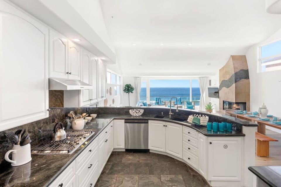 Chef’s Kitchen with High-End Appliances & Marble Counters