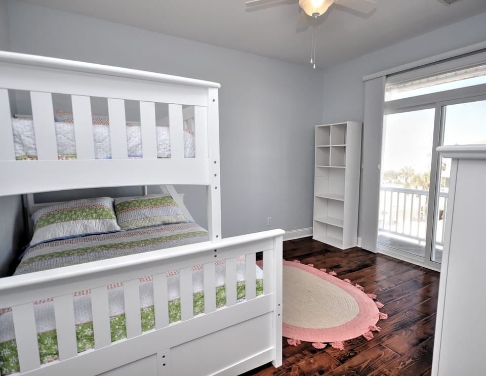Bunk room. Two twins and a double bed with bathroom