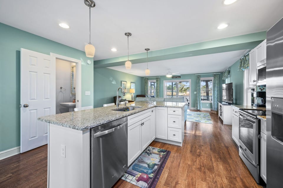 Kitchen has Stainless Appliances and gleaming Granite.