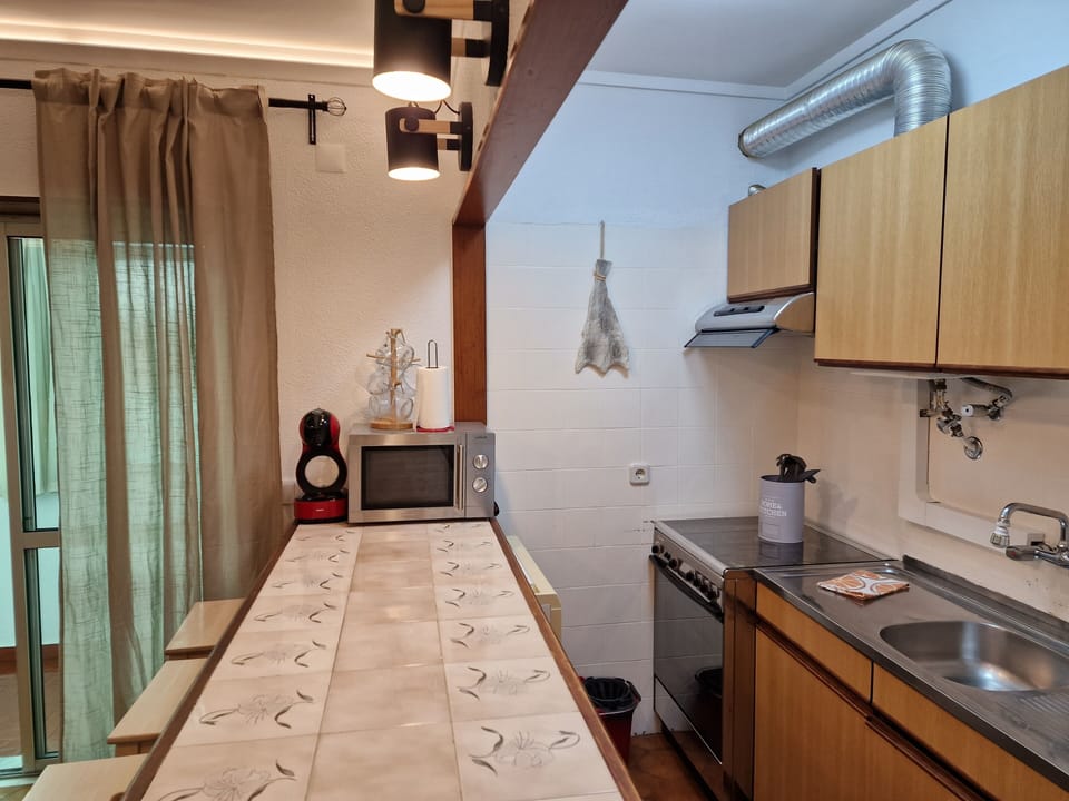 Fully equipped kitchenette with gas stove, oven and microwave