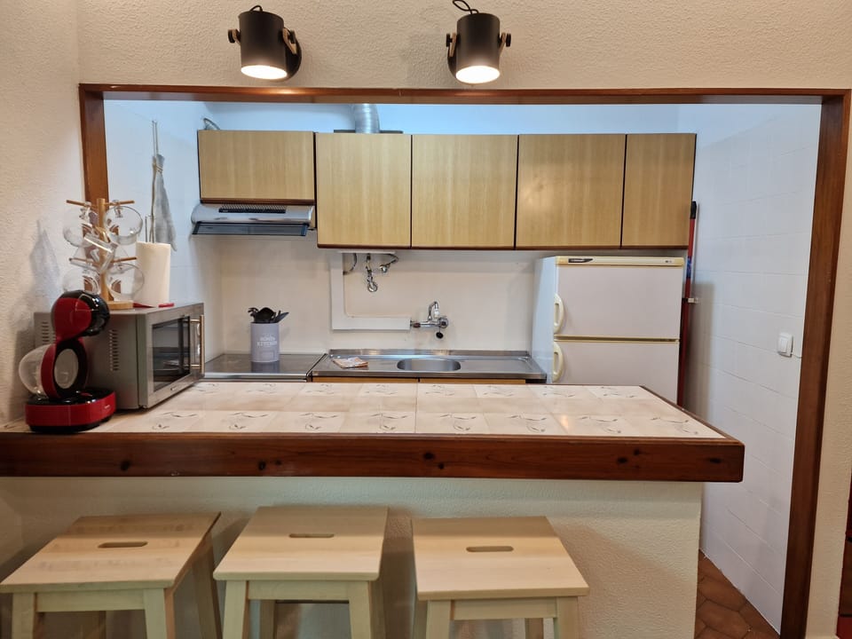 Fully equipped kitchenette with gas stove, oven and microwave