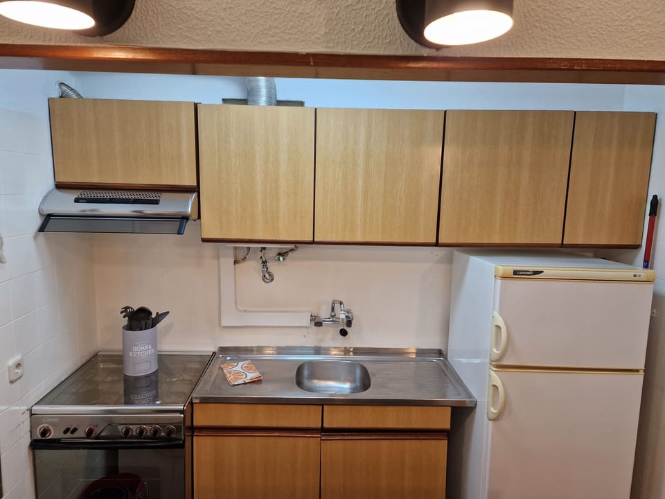 Fully equipped kitchenette with gas stove, oven and microwave