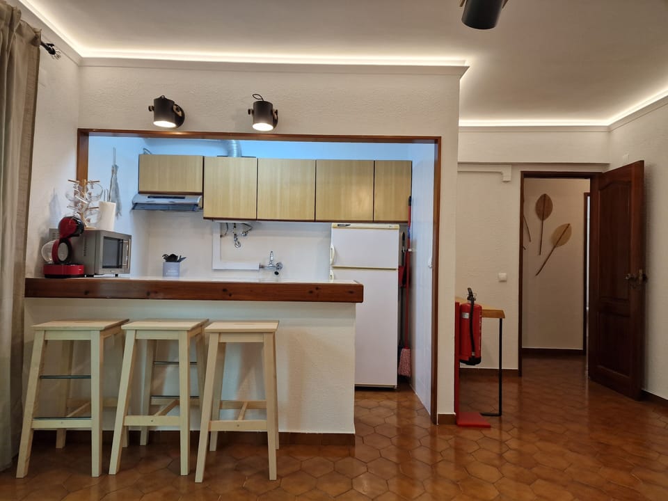 Fully equipped kitchenette with gas stove, oven and microwave.