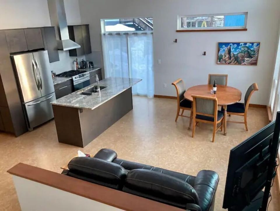 Spacious design for kitchen, living, dining space.