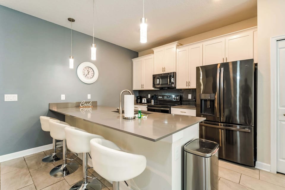 Sleek modern kitchen with stainless steel appliances and a spacious island perfect for family meals and entertaining.