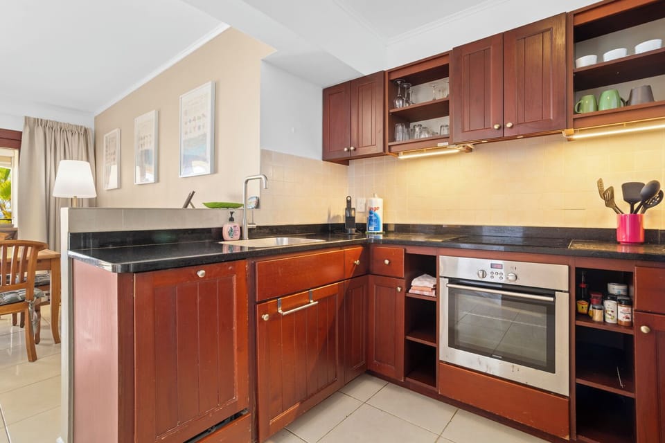 modern open kitchen with oven, microwave, air fryer, blender 