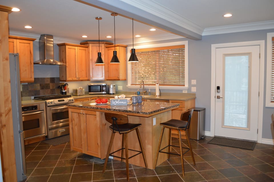 Kitchen with island and access to the walkout deck.