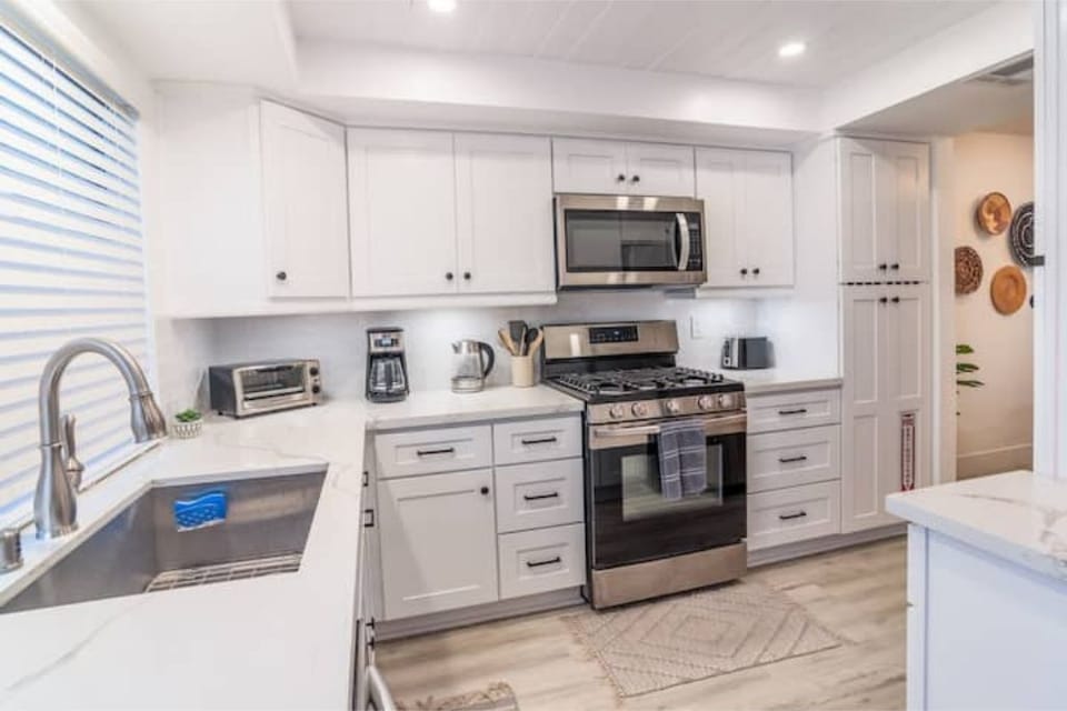 Our beautiful, renovated, fully equipped kitchen. Sink overlooks garden patio.