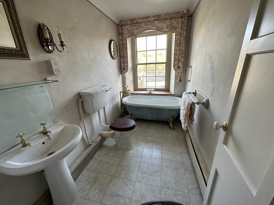 Bathroom 3 with antique roll top bath