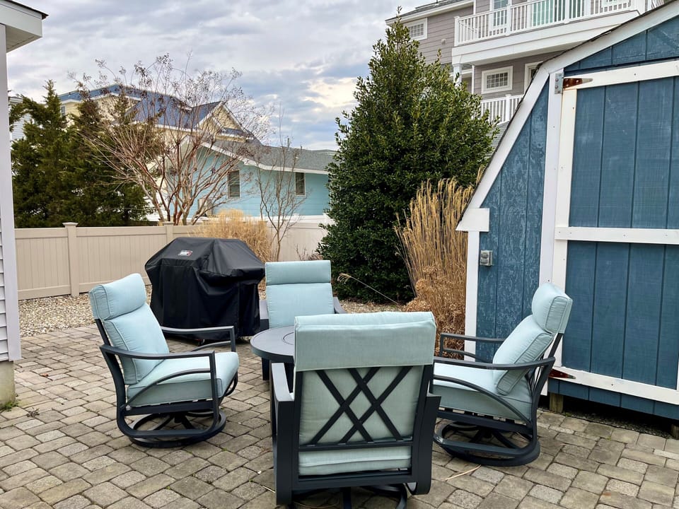 Backyard with Grill, and 4 Outdoor Cushioned Swivel Chairs (no access to shed)