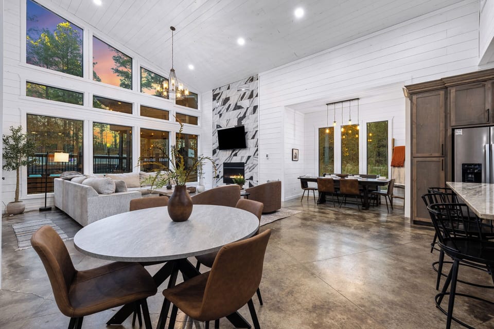 Gather, dine & connect in our inviting open-concept living & dining spaces. Choose from 3 stylish dining spots: a table for 7, a cozy round table for 4, & a chic spacious bar island seating 3—all designed for connection.