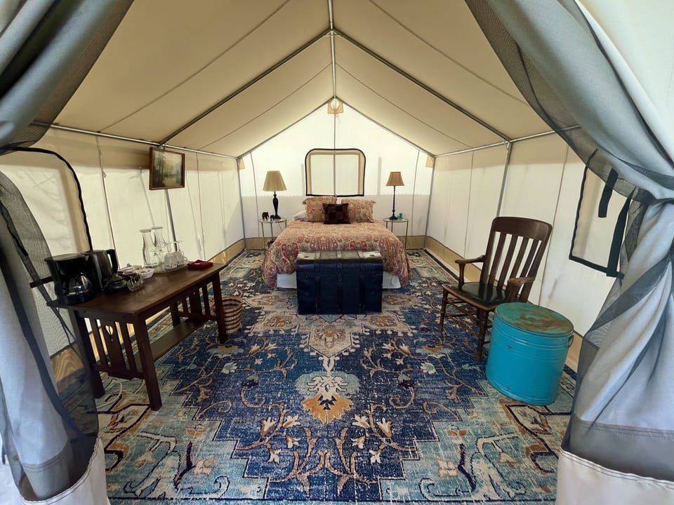 Zinnia Glamping Tent is spacious, beautiful, and cozy with a queen sized bed. 
