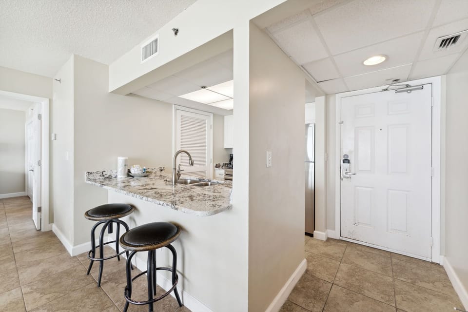 Fully Stocked kitchen with Bar Seating