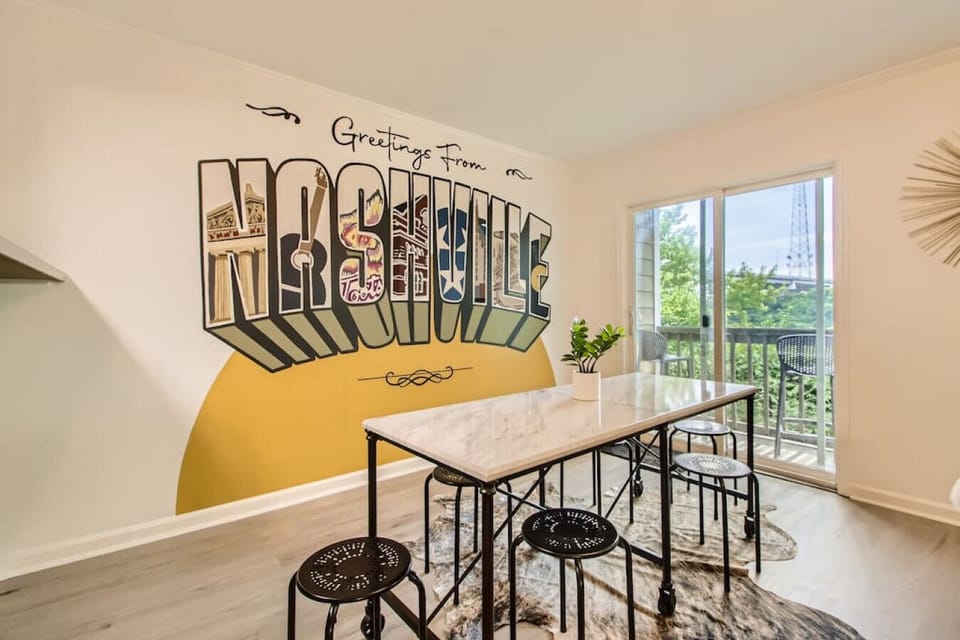 Dining table with seating for 6. The dining area opens up into the living room. Private patio off of this room. Take a photo in front of our custom Nashville mural.