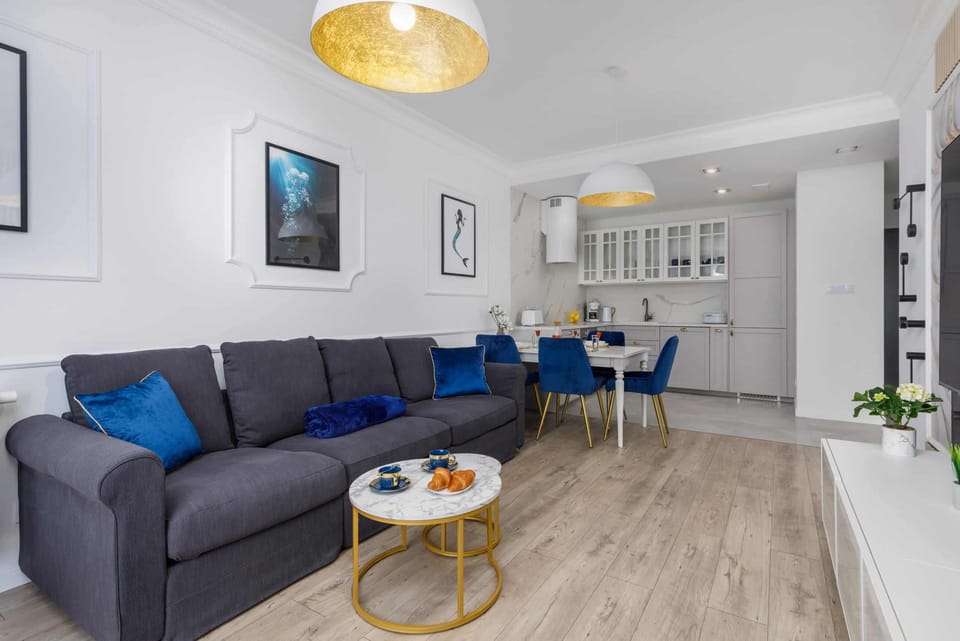 A view of the living and dining area, highlighting its open design and stylish decor elements.

