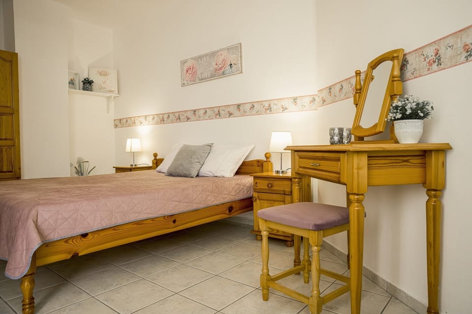 double bed,bedside tables,night lamps, cosmetic table,balkony-sea view