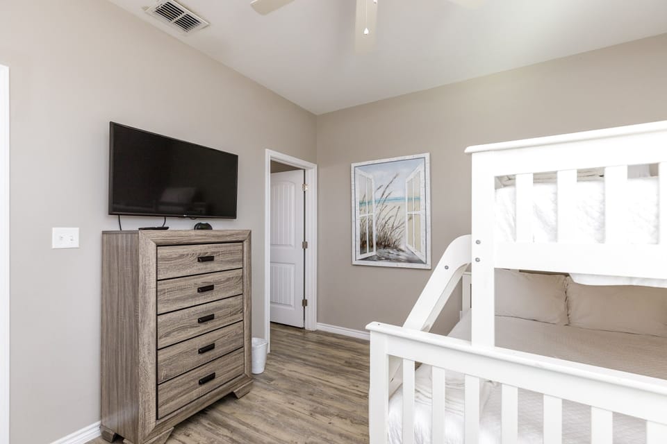 Second floor bedroom with twin over full size bunk bed and full size trundle, along with flat screen TV