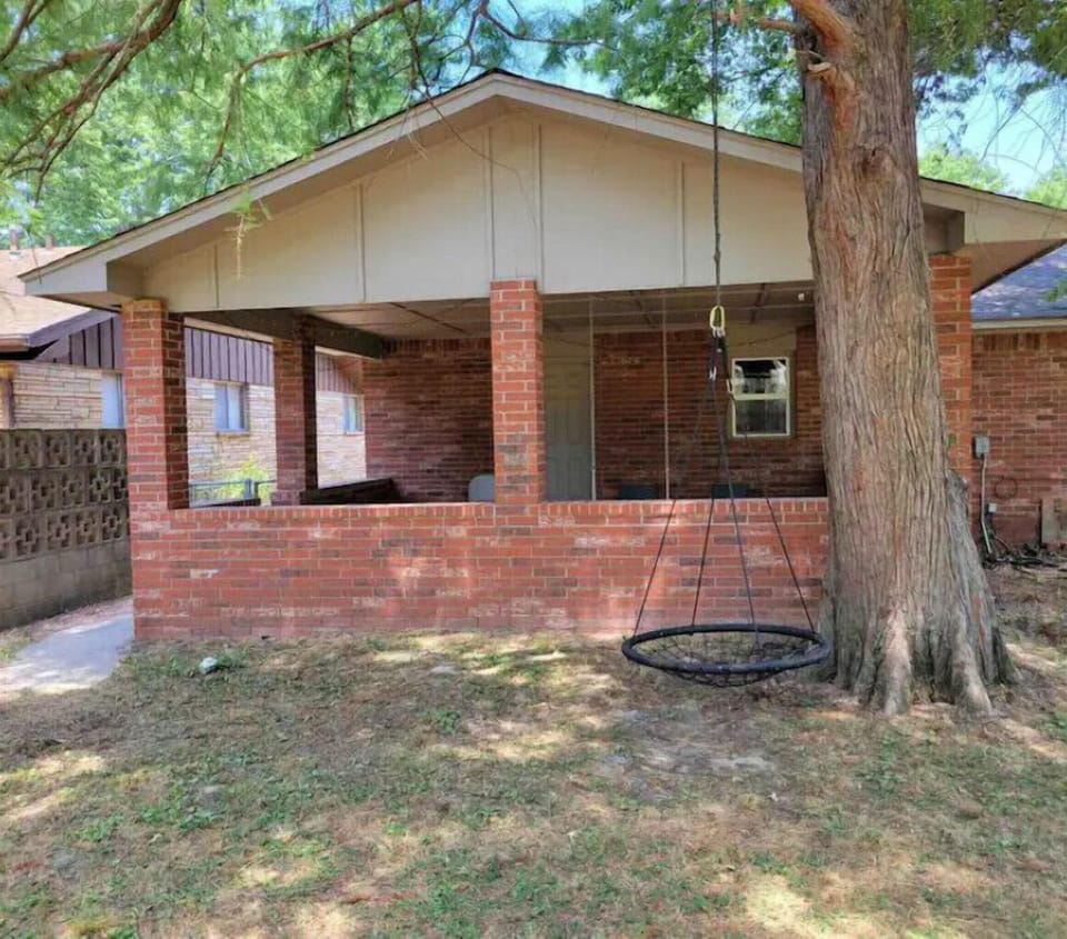 Back patio equipped with grill and outdoor table and chairs 