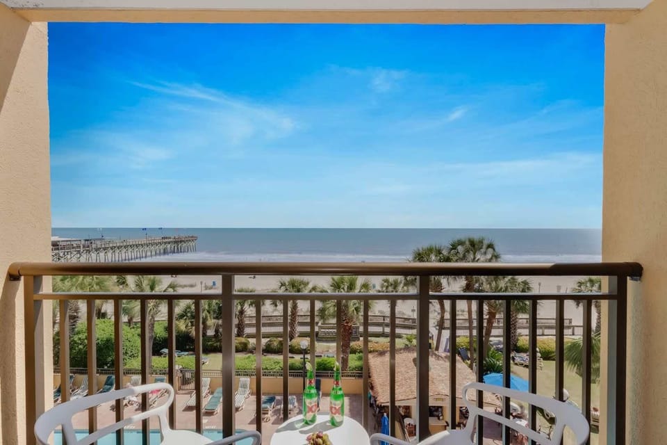 Enjoy stunning ocean views from your private balcony, complete with cozy seating to relax and take in the sights of the beach. Perfect for morning coffee or sunset evenings!