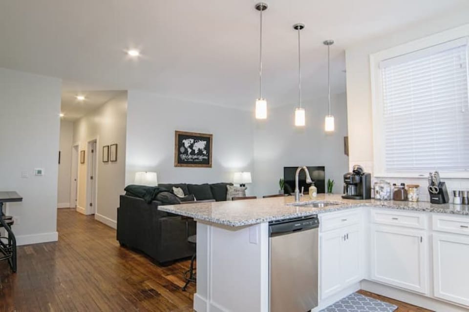 Kitchen with counter seating. Open concept. 
