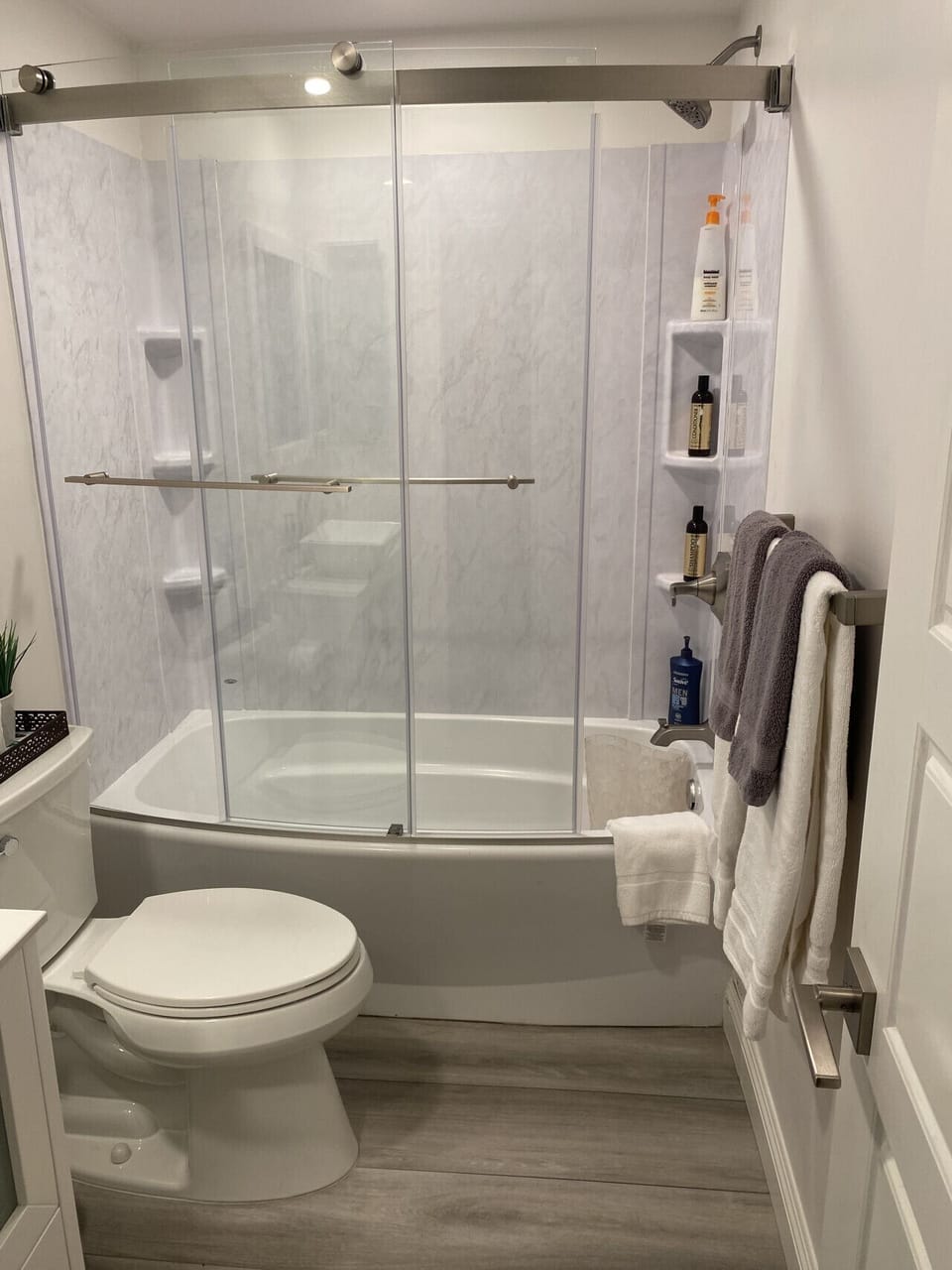 Bathroom with tub and shower, toilet and sink
