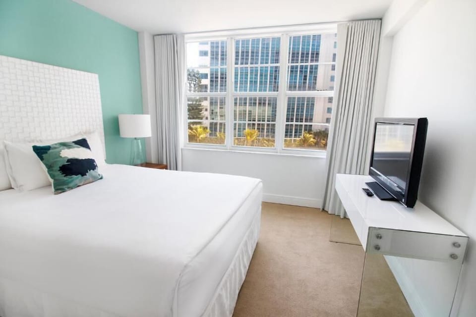 Wake up to daylight pouring through oversized city-view windows.