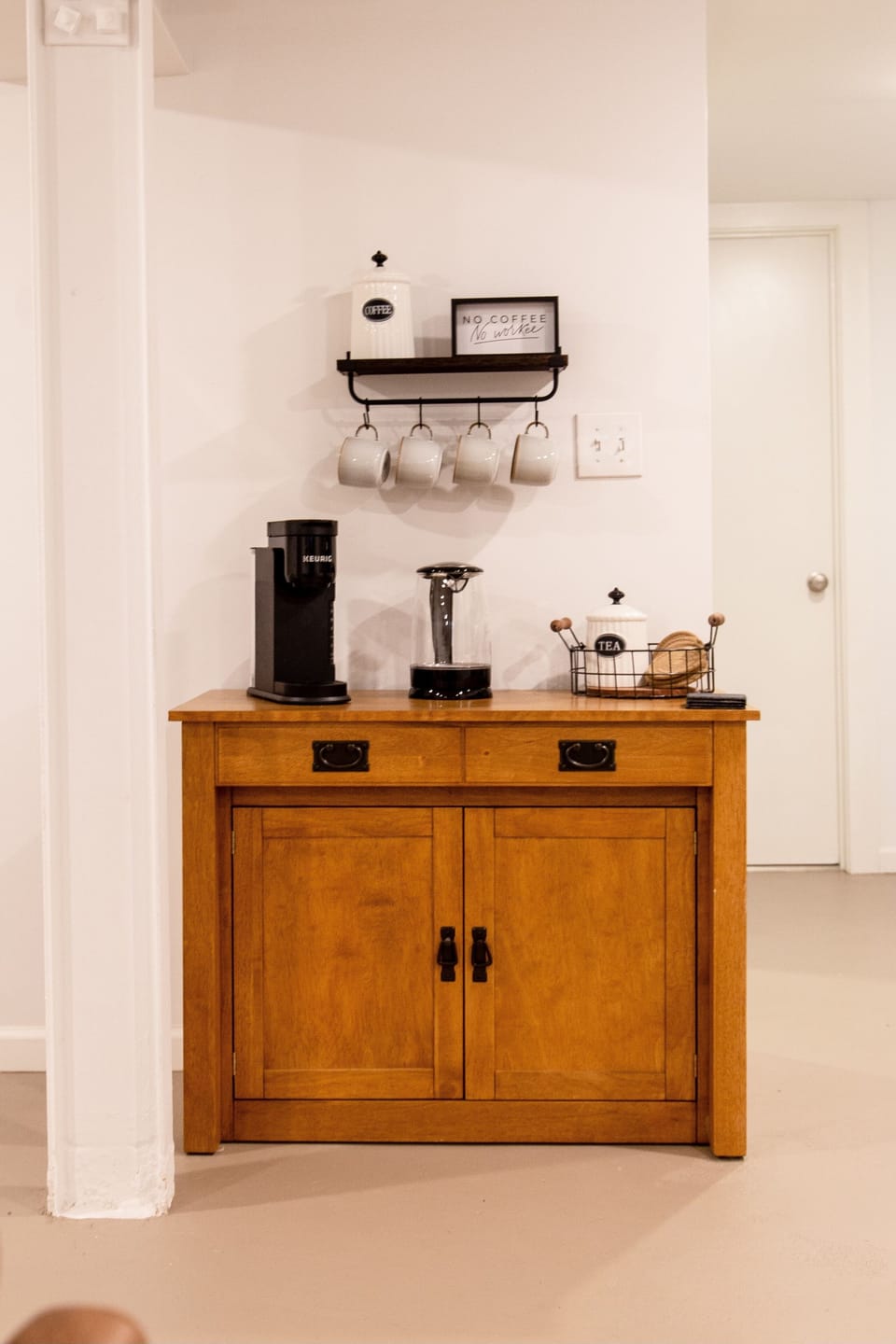 Coffee Bar stocked with Keurig, French Press, Electric Kettle, coffee & tea.