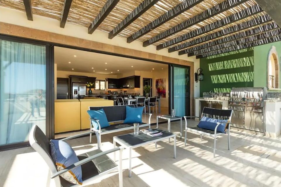 Terrace equipped with grill and social area.
