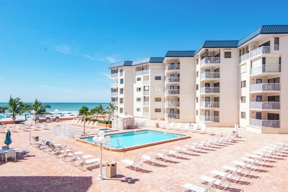 Heated Pool & Hot Tub open year round with ample seating, overlooking Gulf of Mexico.