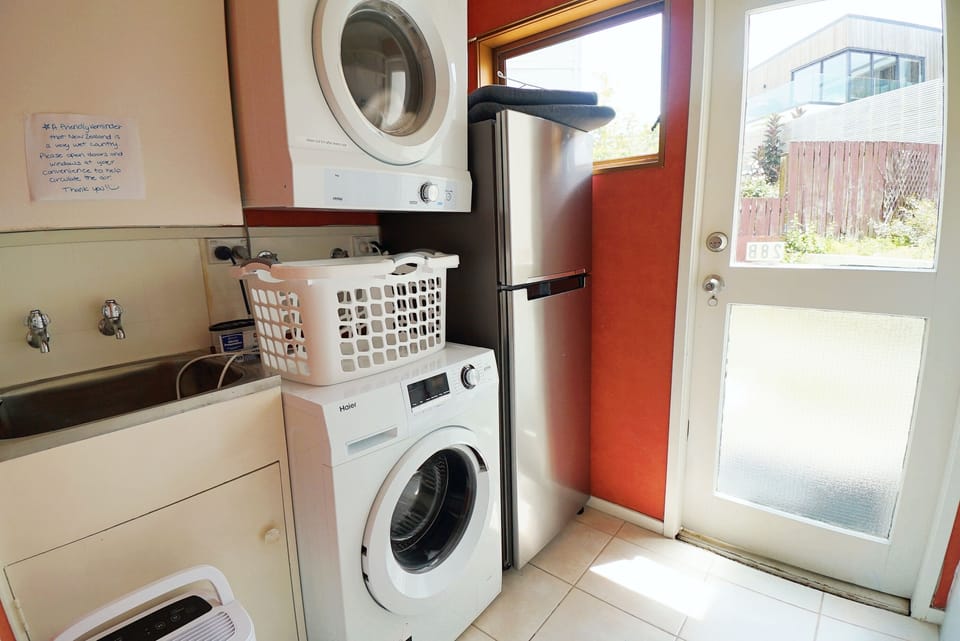 washer, dryer, 2ed fridge, sink and backyard with all day sun light. 