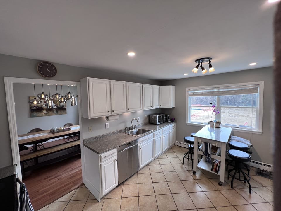 Kitchen w/new dishwasher and new refrigerator ...