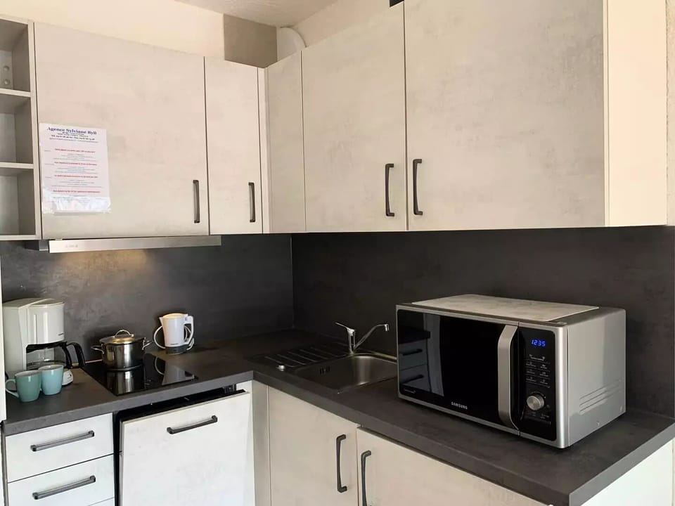 Fridge, microwave, cookware/dishes/utensils