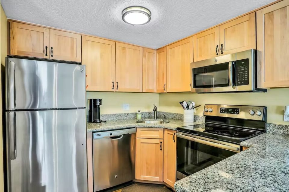 This fully equipped kitchen features modern appliances and ample counter space for effortless meal preparation.