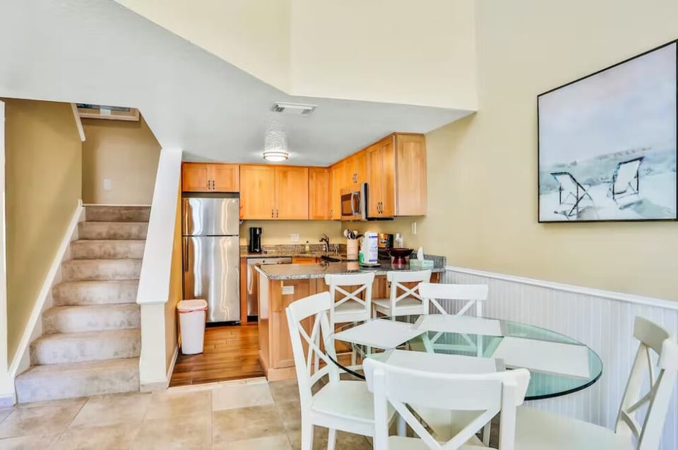 A charming staircase leads to the bedrooms, creating a welcoming transition to your private retreat.