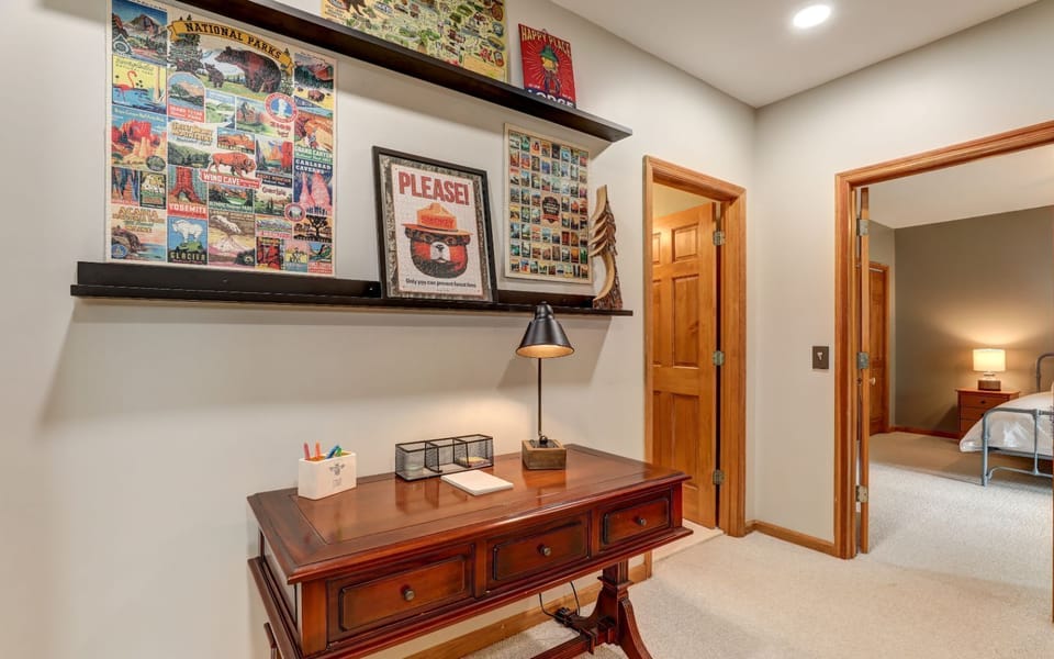 Beautifully decorated small desk with posters and cozy lighting.