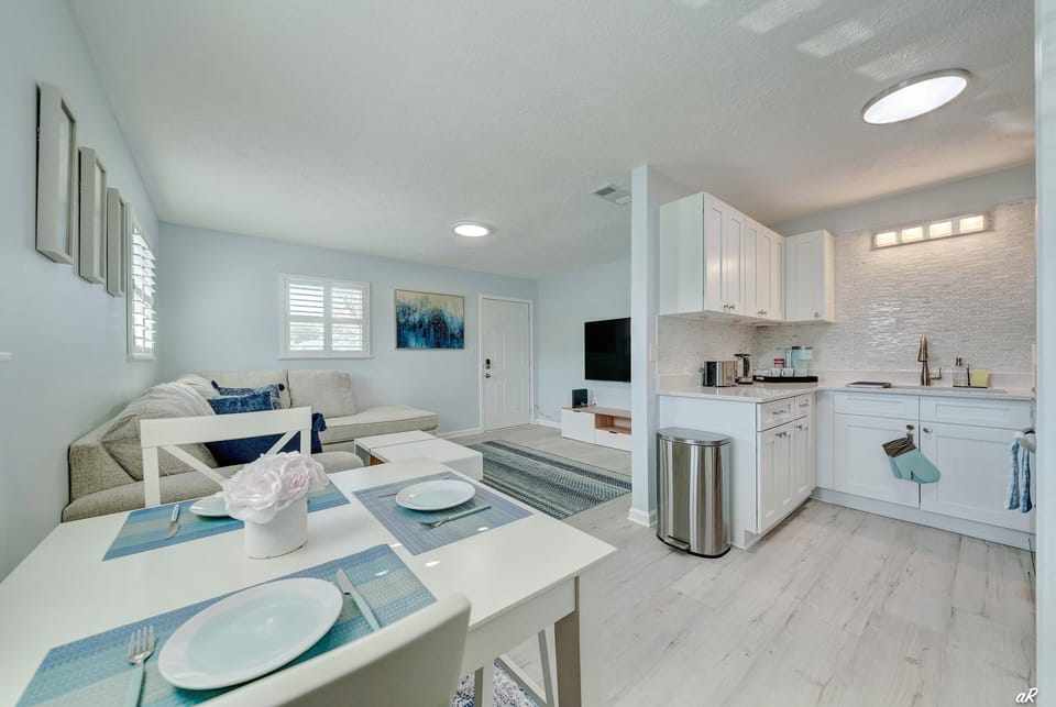 High-top Dining Table with Seating for Two and Fully Equipped Kitchen