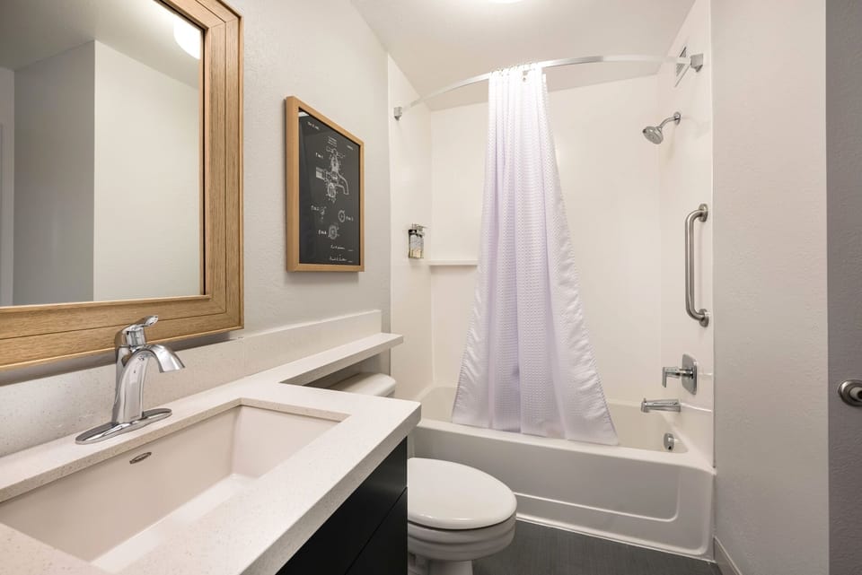 Rinse off in a spotless tub-shower after a busy day.