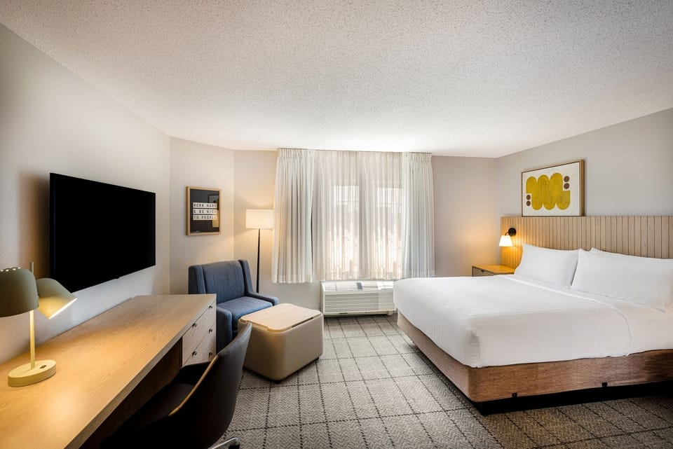 Settle into a spacious room with lounge chair and HDTV.