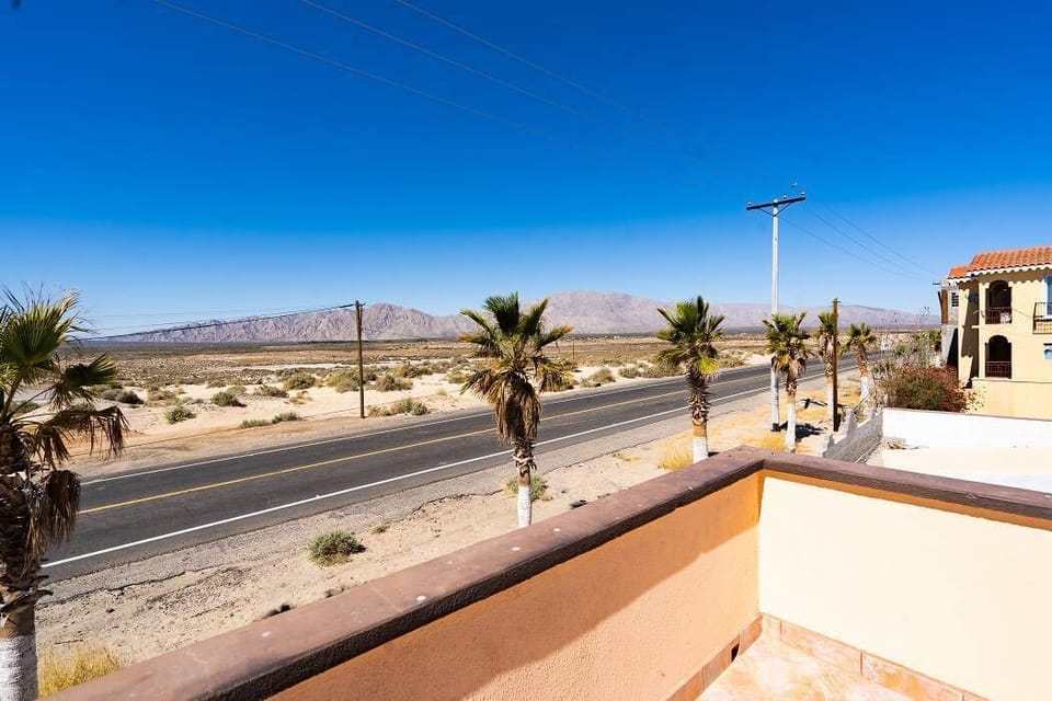 Enjoy the front terrace view at Casa Seascape in Villas de Las Palmas — open sky and desert landscape.