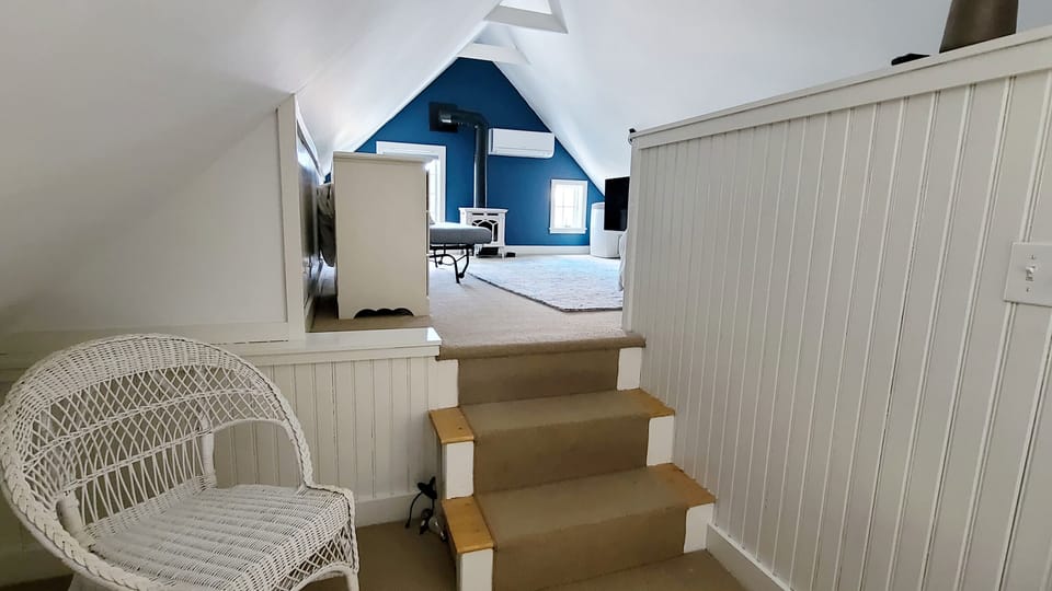 Third floor bedroom with queen bed