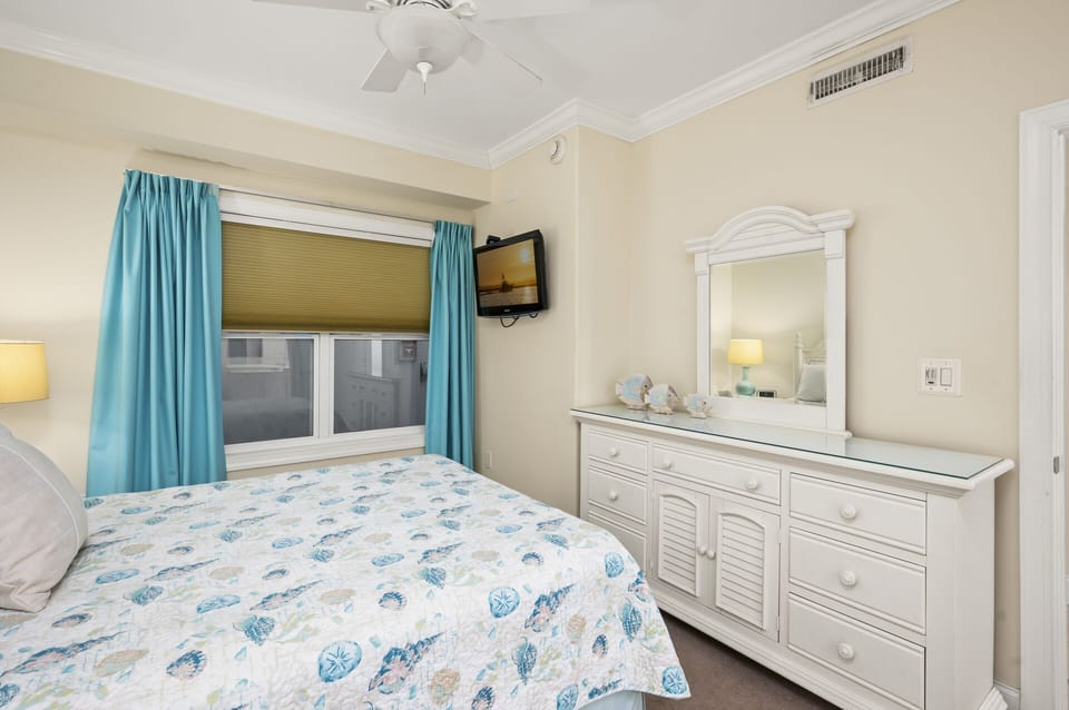 Enjoy the Flat Screen TV in this Cool & Calming Bedroom.