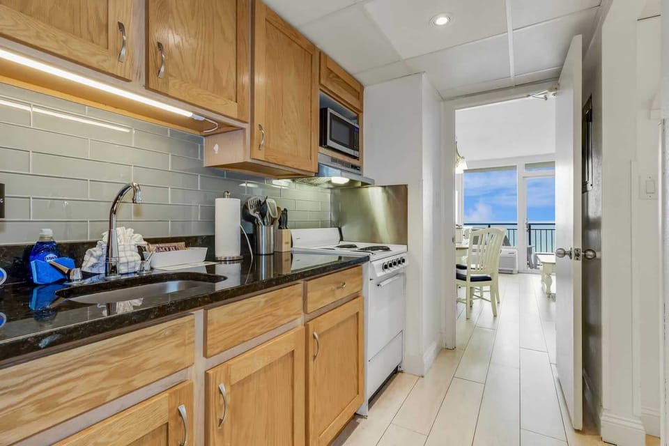 Whip up your favorite beach snacks in this charming, fully stocked kitchen—complete with ocean views just steps away. Who says you can't cook with a view?