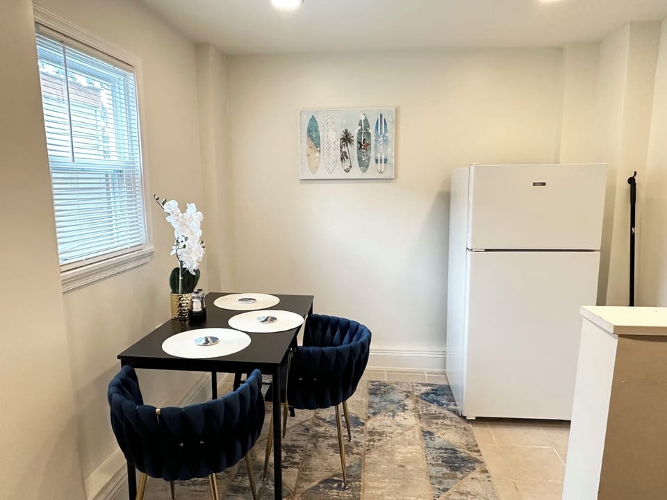 Dinner room with full refrigerator 