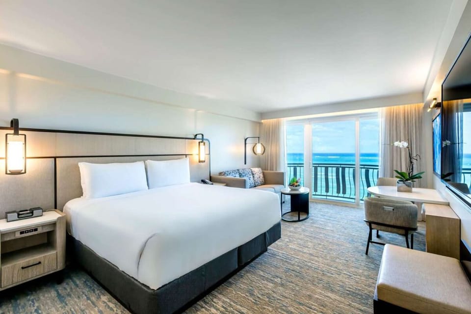 Wake to ocean blues and airy comfort in bed.