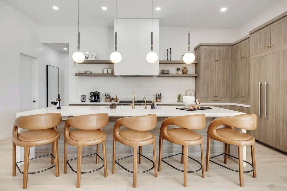 Chef’s Dream Kitchen – Cook like a pro with this spacious kitchen, featuring high-end appliances, floating shelves, and a large island perfect for meal prep or casual dining.