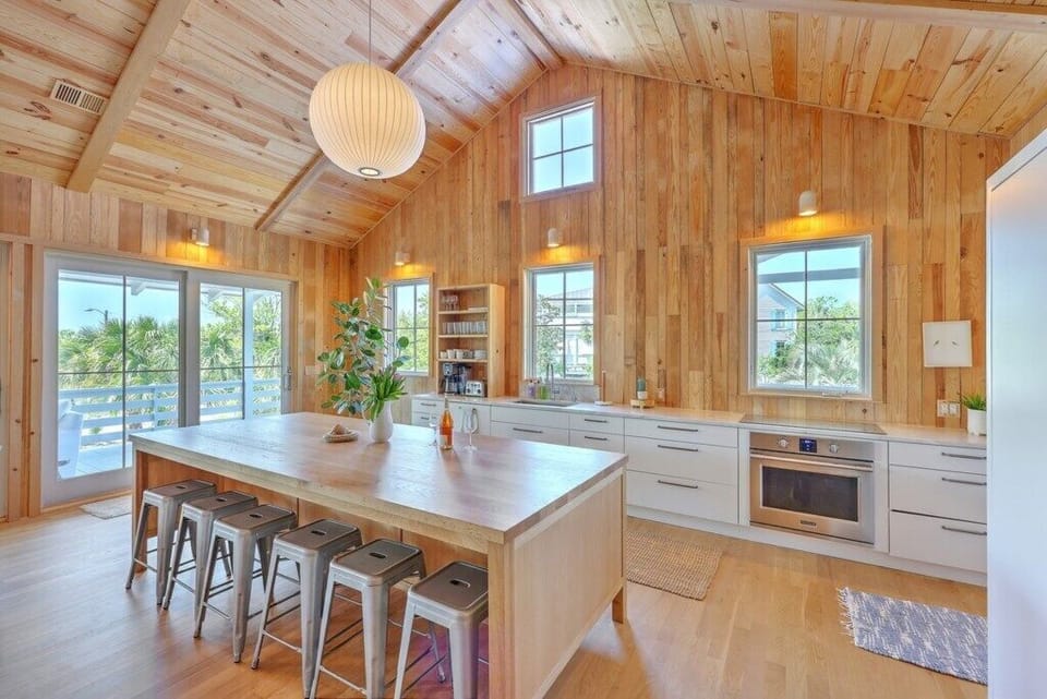 Spacious kitchen island with seating, ideal for gatherings and casual dining.