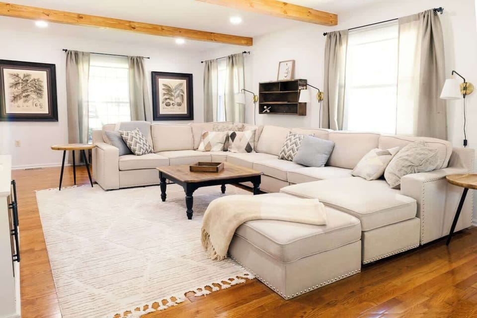 Step into our stunning living room, where the space flows seamlessly into a spacious dining area.