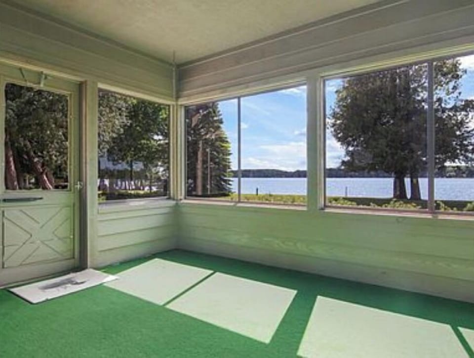 Sun Porch -- now has wicker rocker, couch and table with 4 chairs