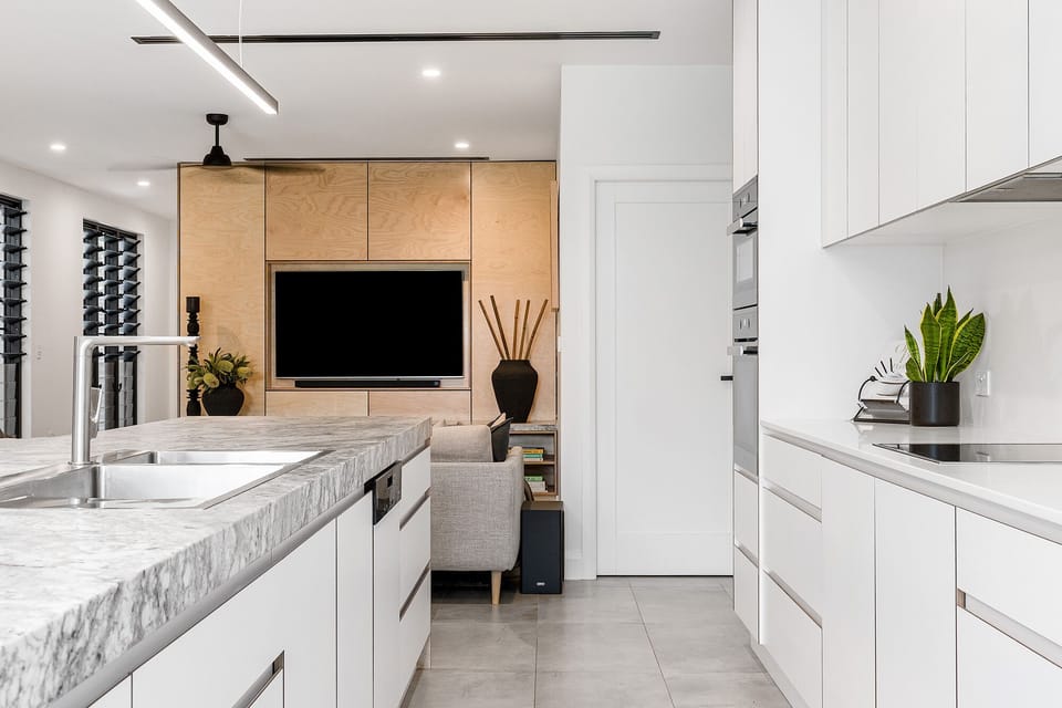 Kitchen to butler's pantry and living area.